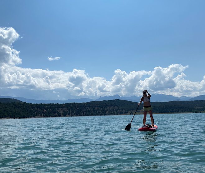 stand up paddleboarding on a lake